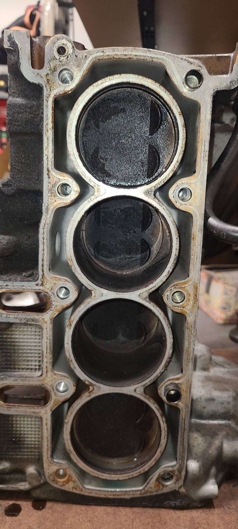 Original K1100 engine block showing worn and dirty bores before rebuild