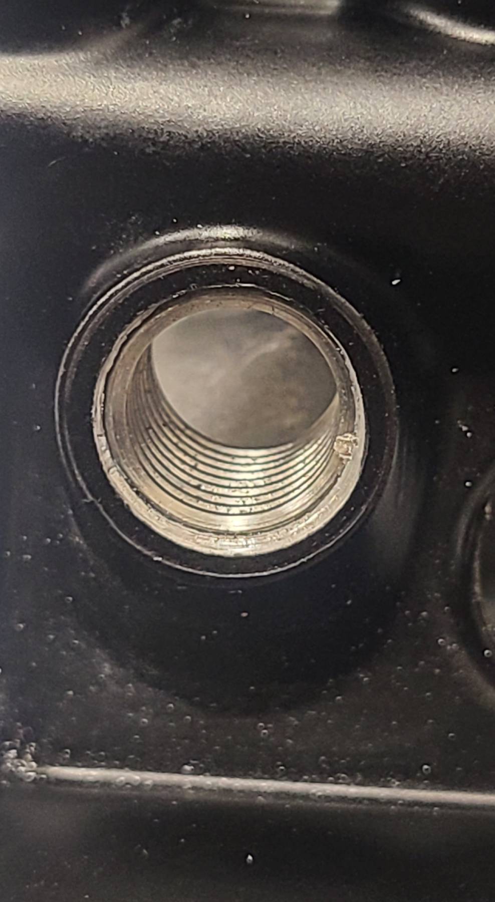 Water pump threads repaired with a Helicoil