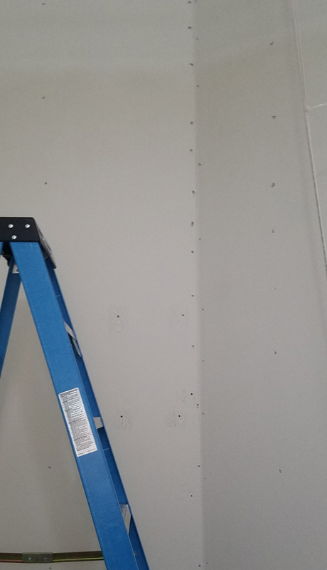 Drywall screws marked before removing the studio walls