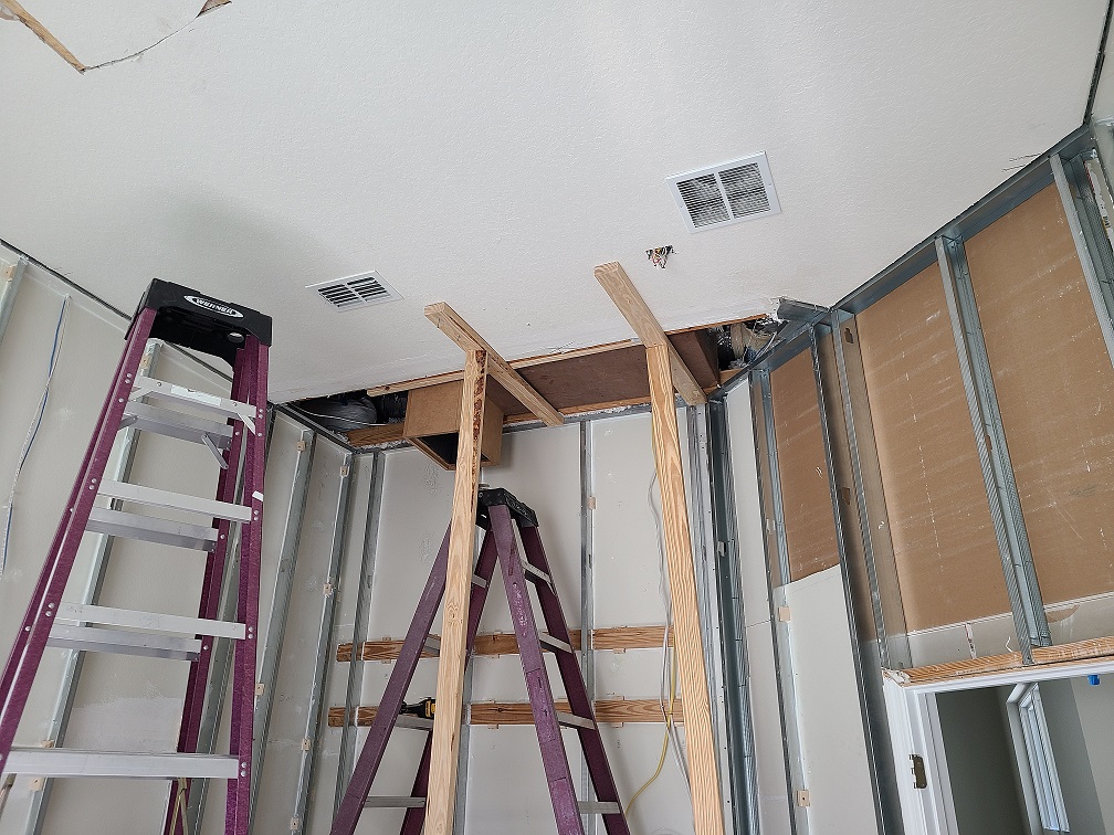 Silencer box installed between structural members